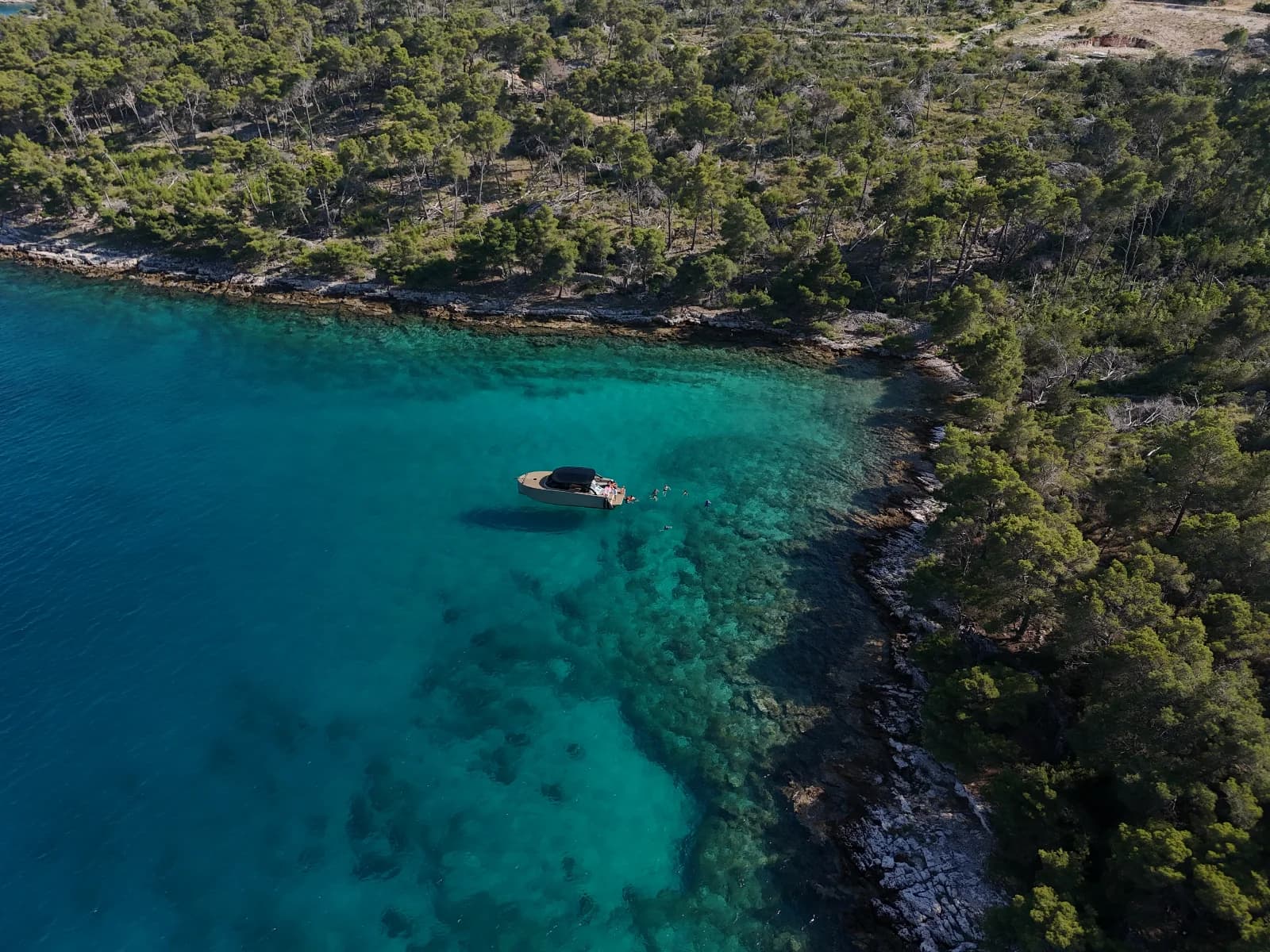 Swimming off the boat in the clear shallows at Milna