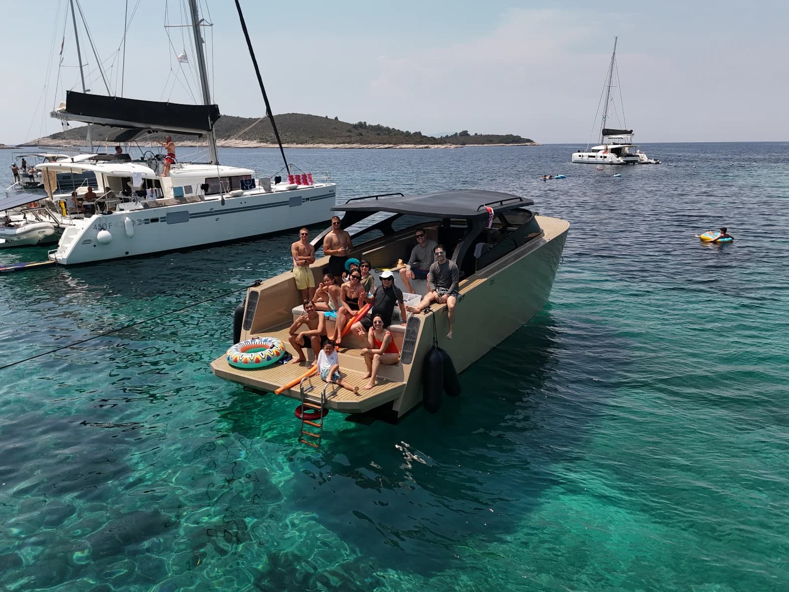 Guests on the swim platform at Ždrilca, in the Pakleni archipelago