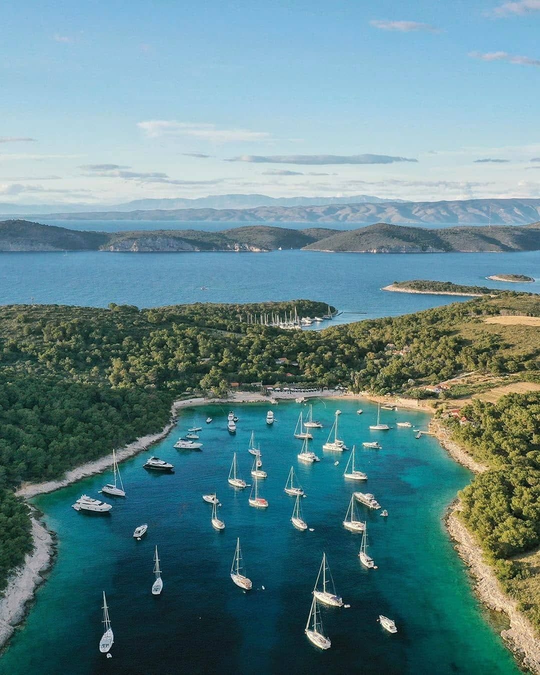 Hvar town waterfront and the Pakleni Islands archipelago seen from a private boat