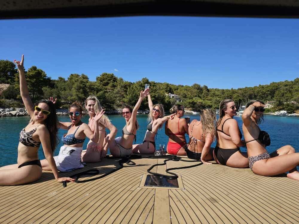 Rebelde Boats crew and guests on deck during a private Adriatic tour from Split
