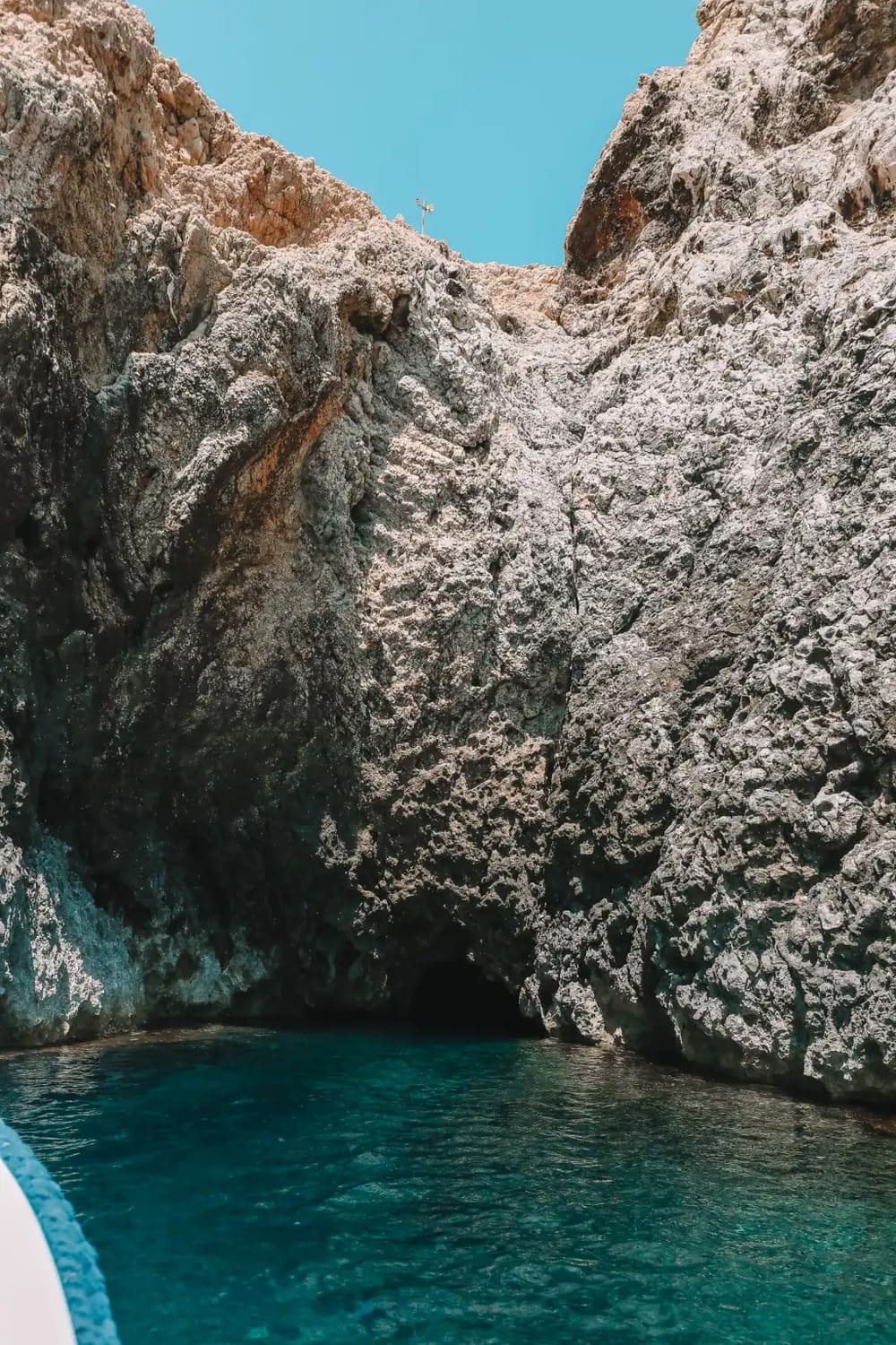 Towering cliffs guarding the entrance to the famous sea cave