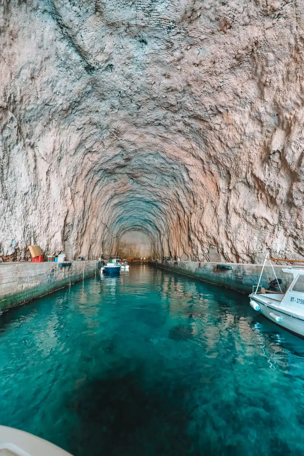 Gliding through the long stone tunnel of the submarine pen