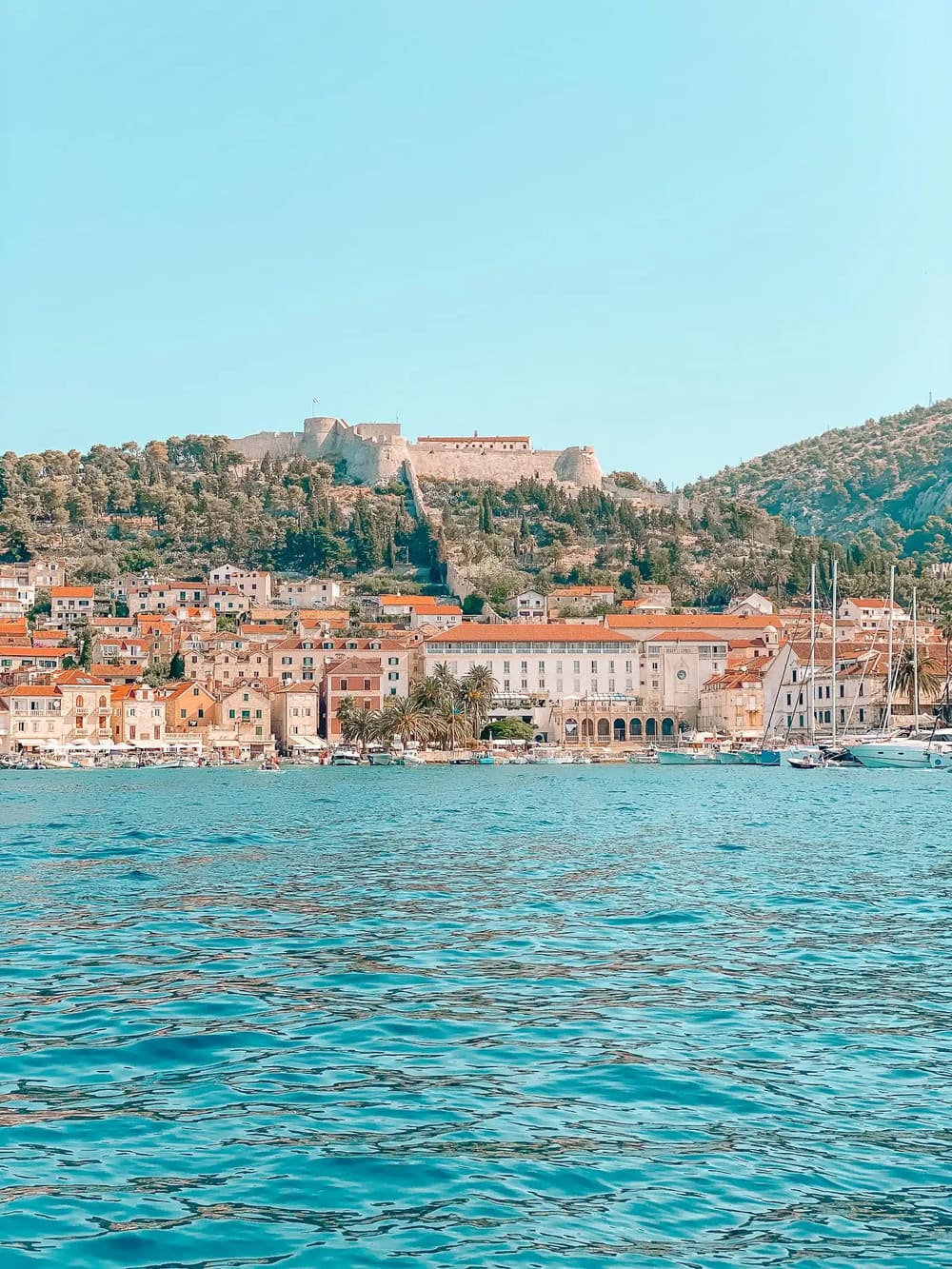 Sailing into Hvar with the "Fortica" Fortress watching from above