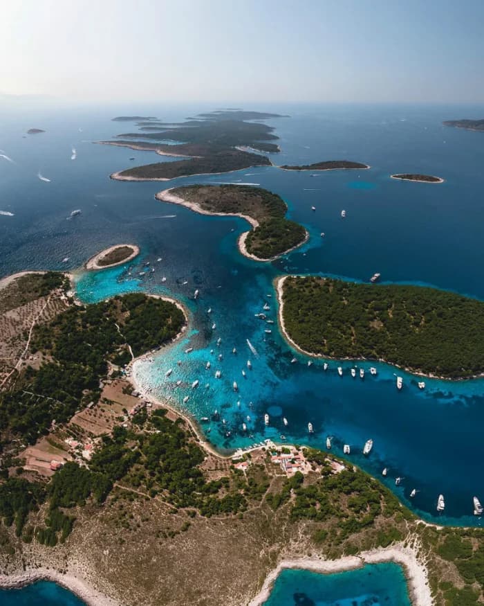 Hvar town waterfront and the Pakleni Islands archipelago seen from a private boat