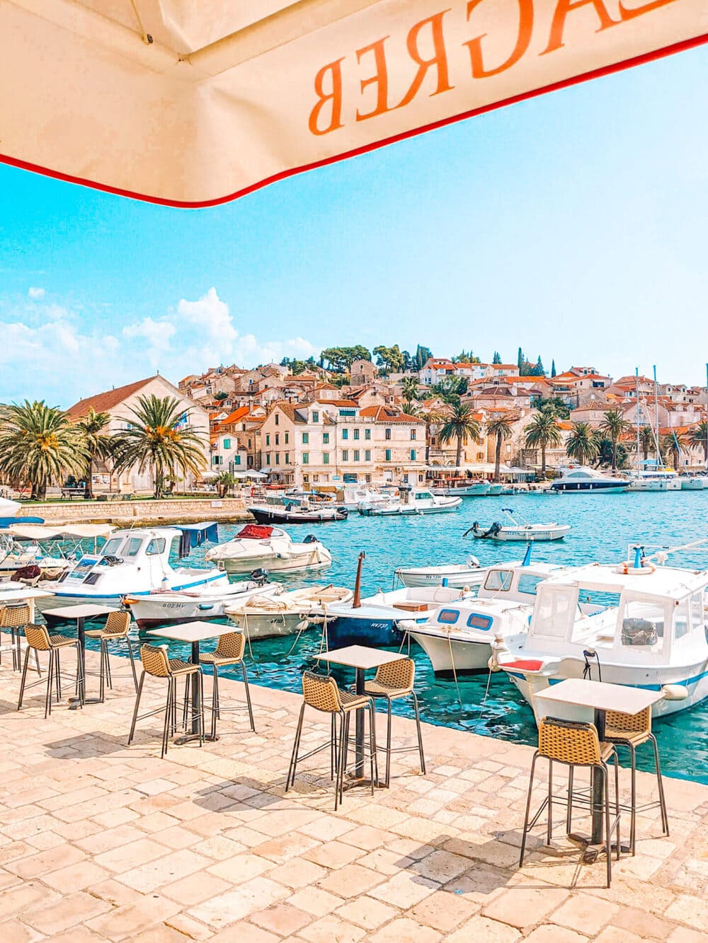 A waterfront table with Hvar's rooftops as the view