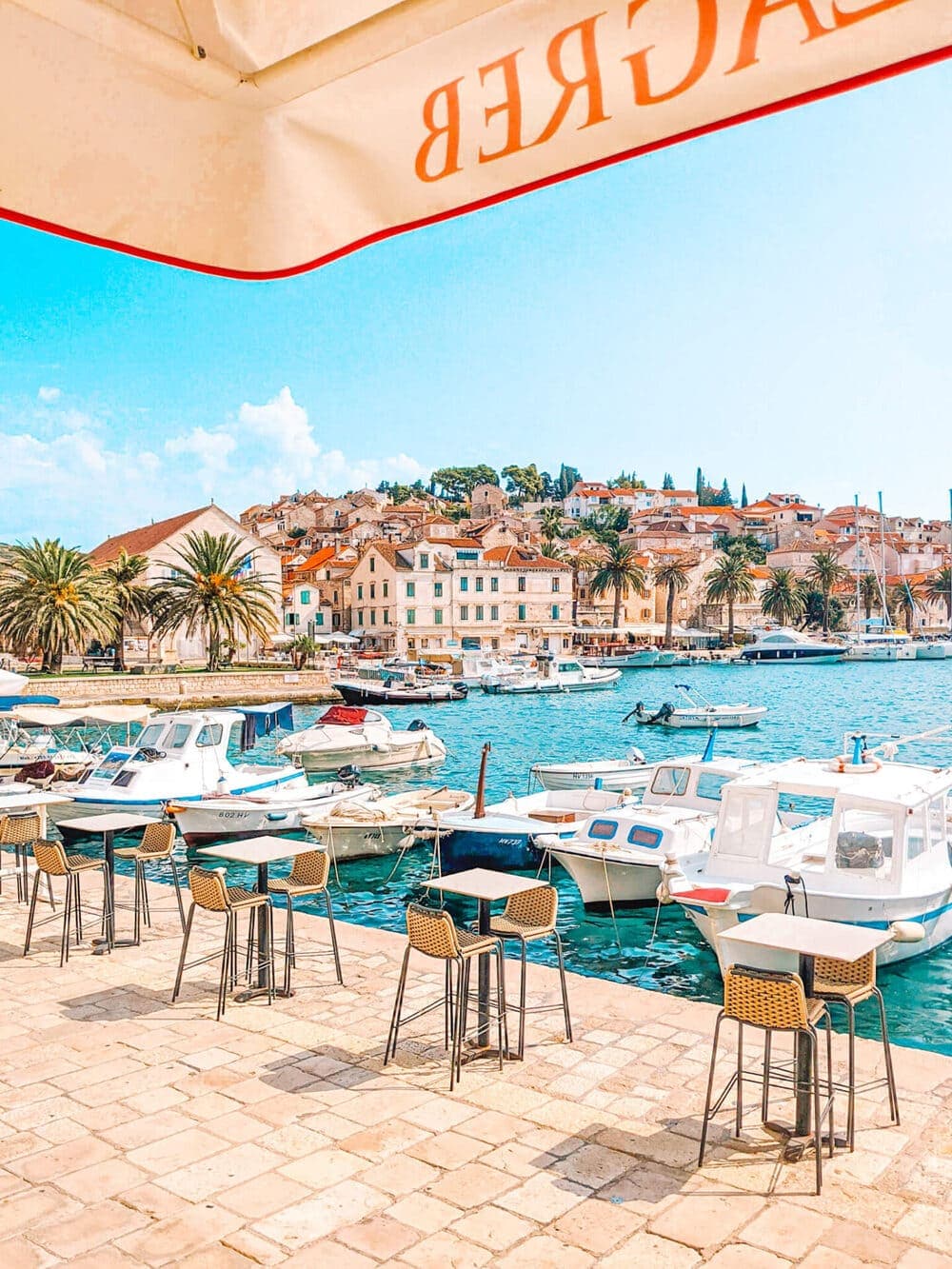 A waterfront table with Hvar's rooftops as the view